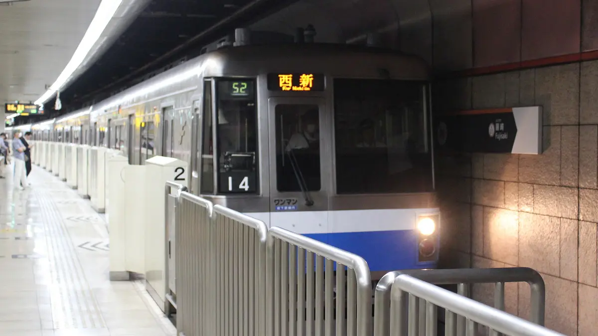 Hakozaki Line 1000N series train heading from Nishijin Station to the depot