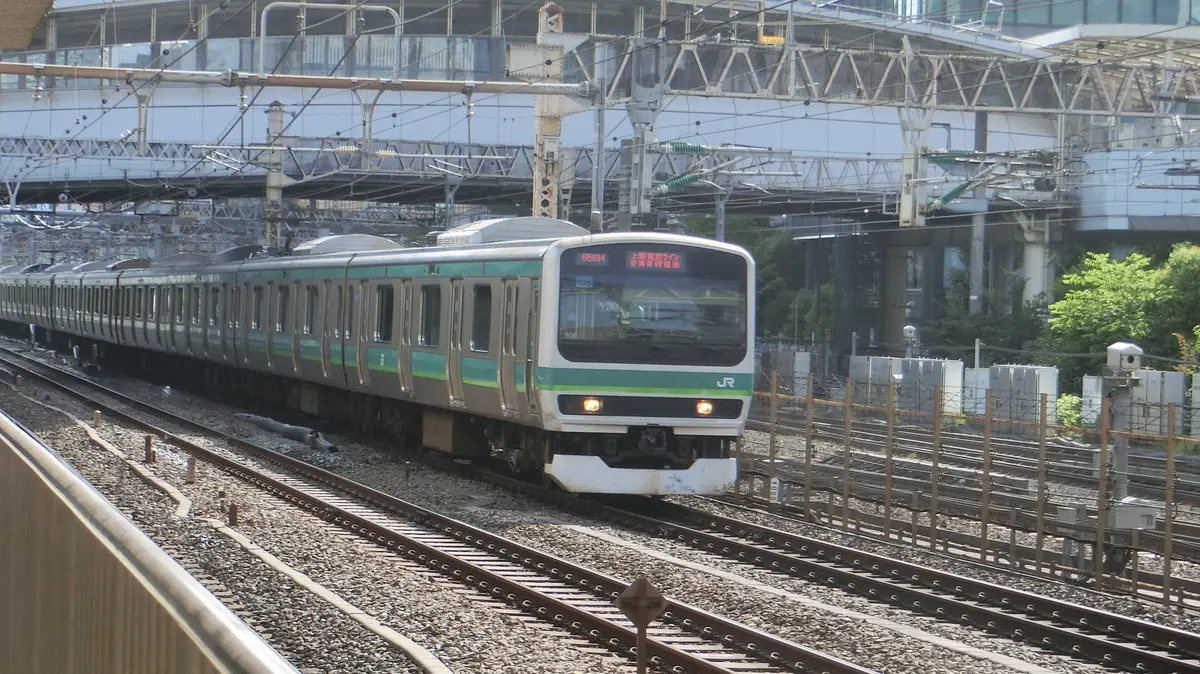 Joban Line Rapid E231 series train running on the Ueno-Tokyo Line and passing Tamachi Station