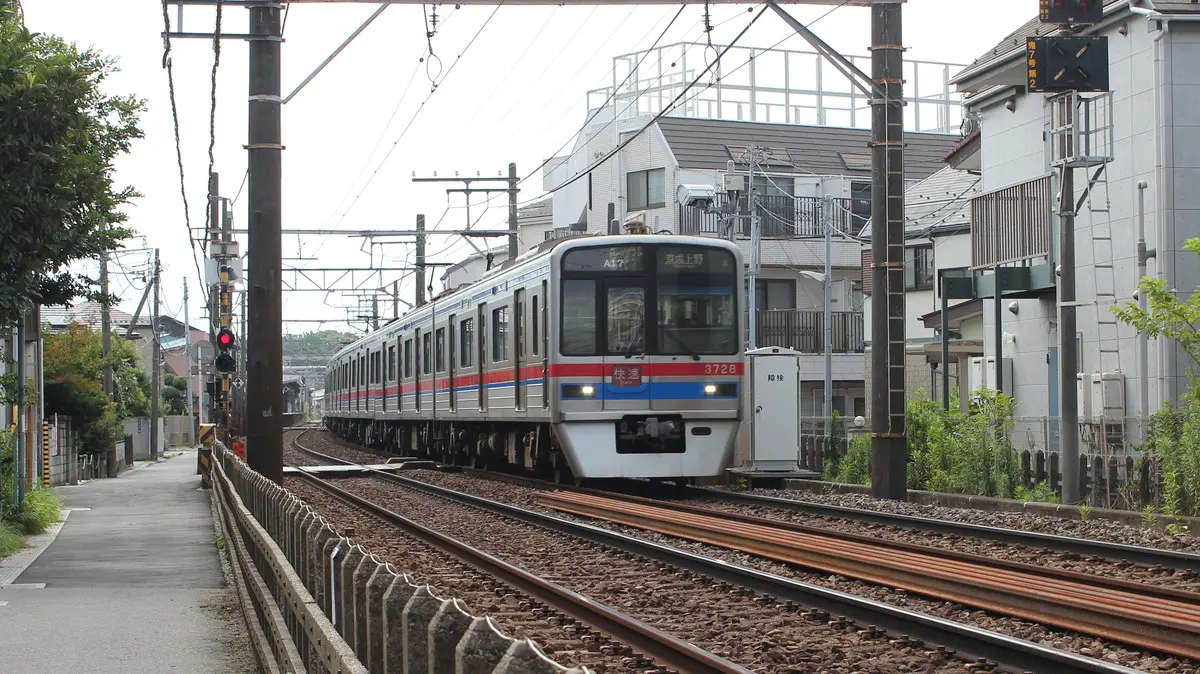 Keisei Main Line 3700 series train departing Keisei Nakayama Station
