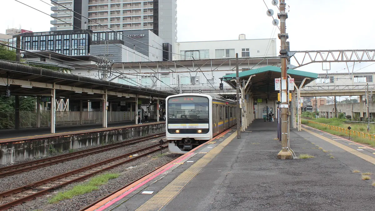 Narita Line 209 series train waiting to depart at Narita Station