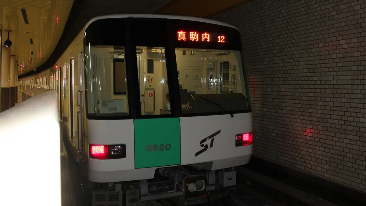 Sapporo Municipal Subway Namboku Line 5000 series train stopped at Asabu Station