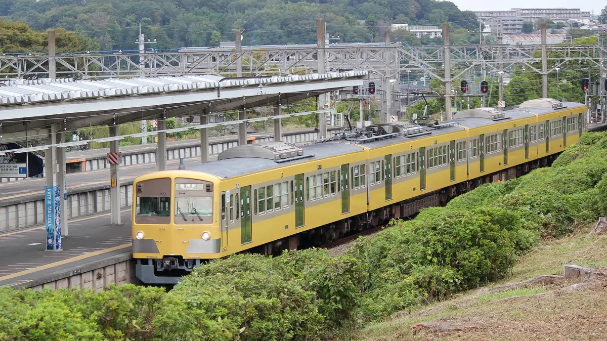 Seibu Sayama Line 101 series train arriving at Seibu Kyujo-mae Station