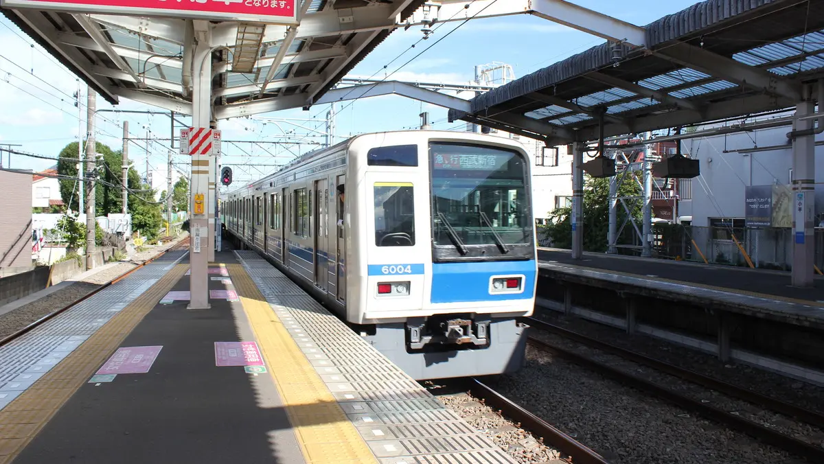 Seibu Shinjuku Line 30000 series train departing Kodaira Station