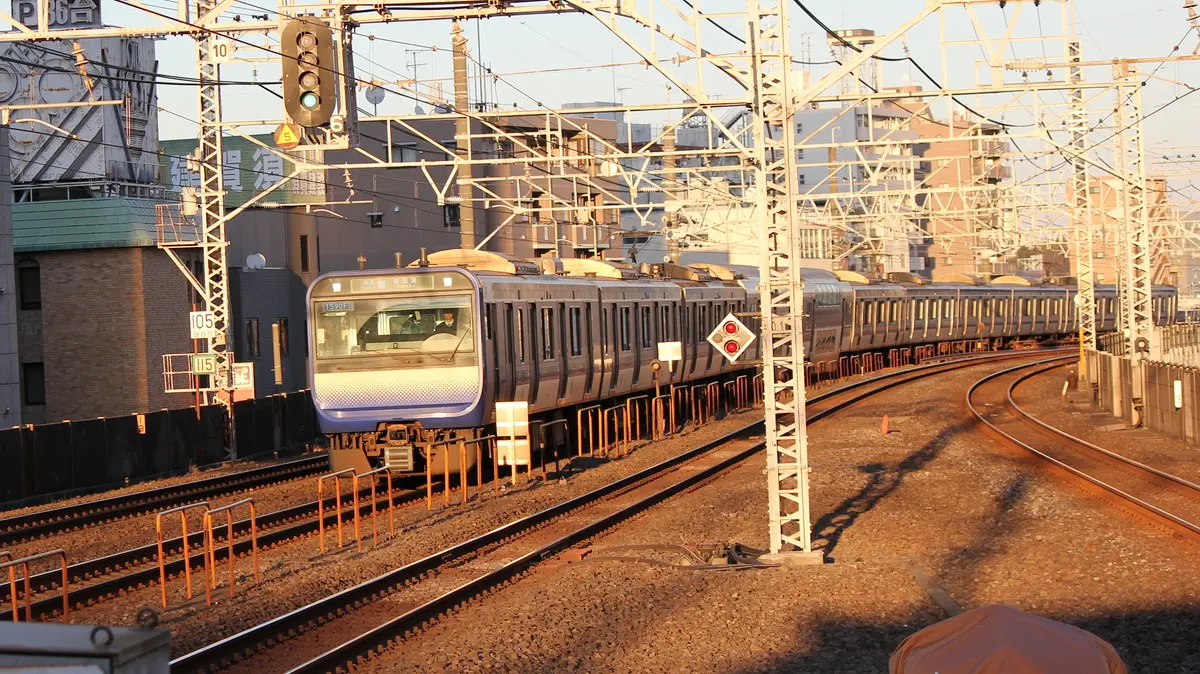 Sobu Rapid Line E235 series train passing through Koiwa Station