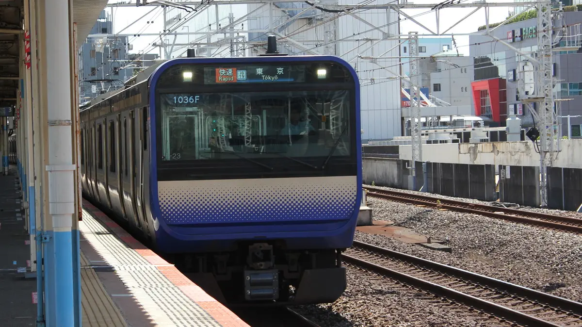 Sobu Rapid Line E235 series train stopped at Funabashi Station