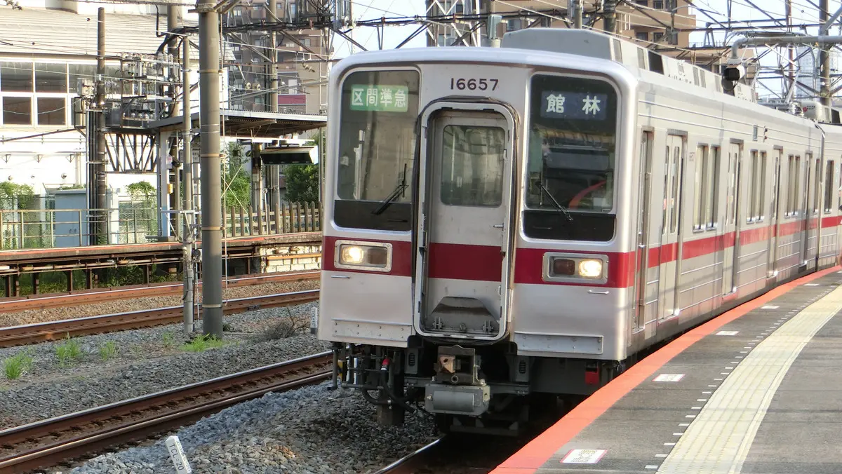 Tobu Isesaki Line 10000 series train departing Kanegafuchi Station