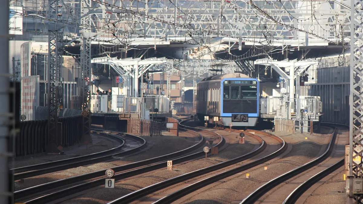A 6500 series train coming directly from the Toei Mita Line departs Shin-Maruko Station