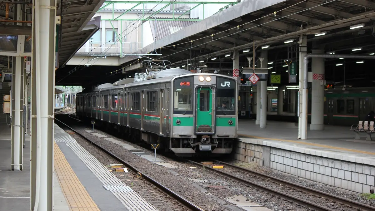 Tohoku Main Line 701 series train parked at Sendai Station