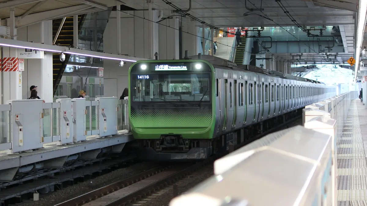 JR Yamanote Line E235 series train arriving at Takanawa Gateway Station